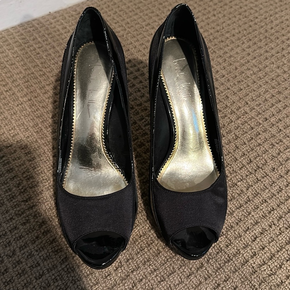 Black patent and silk heels. We were a few times but very good condition.